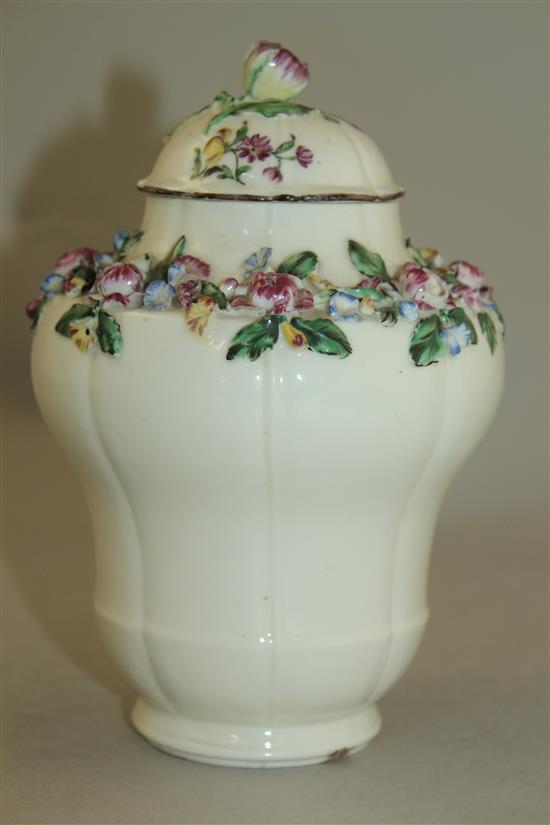 A Mennecy porcelain floral encrusted ogee-shaped vase and cover, c.1760, 17.5cm